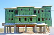 Ramsey modern coastal piling hojme in Navarre Beach by Acorn Fine Homes