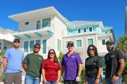Modern coastal piling home in Navarre by Acorn Fine Homes