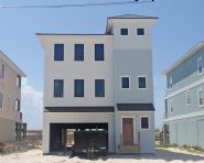 Davis modern coastal piling home on Navarre Beach by Acorn Fine Homes