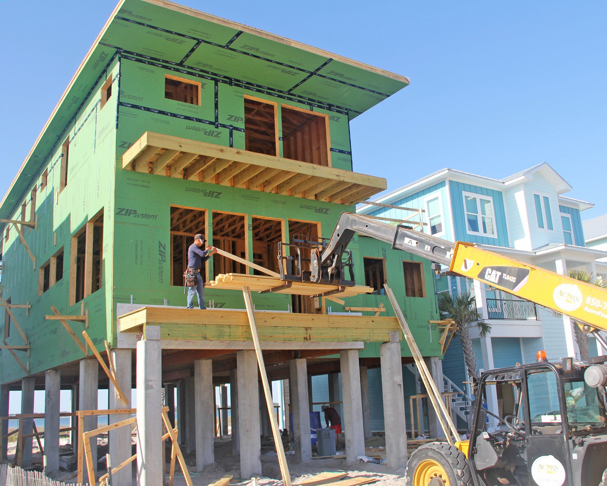 Modern piling home in Navarre by Acorn Fine Homes