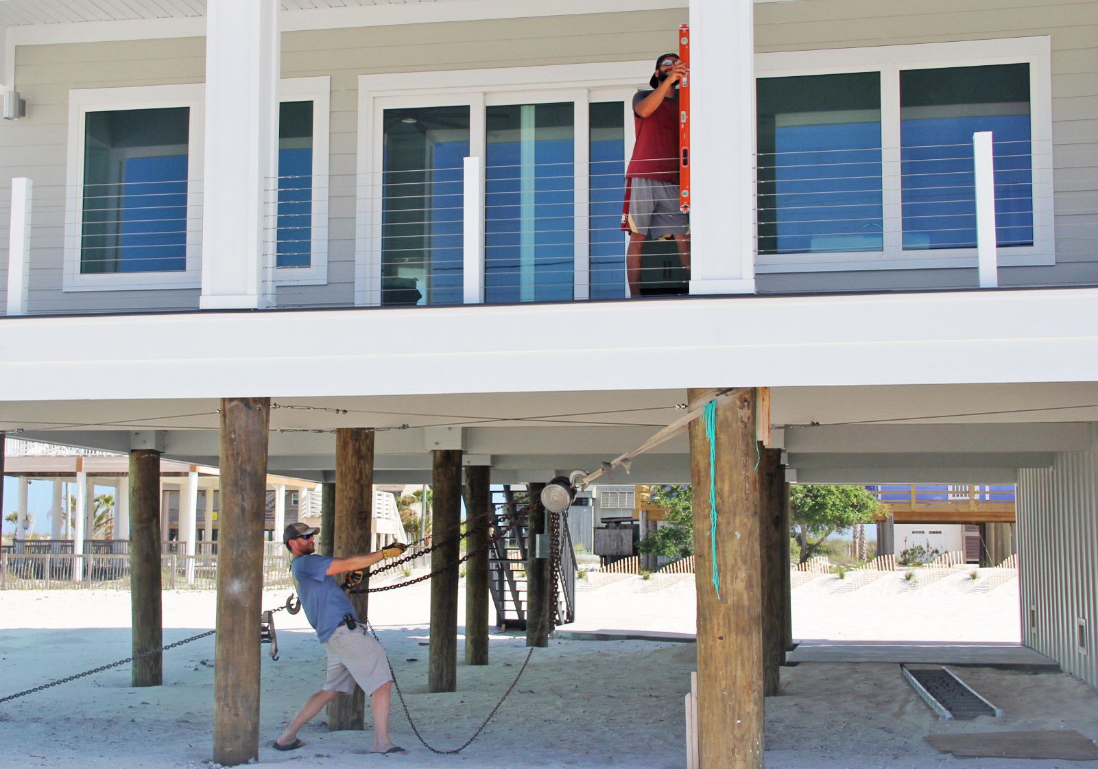 Moreland modern piling home on Navarre Beach by Acorn Fine Homes