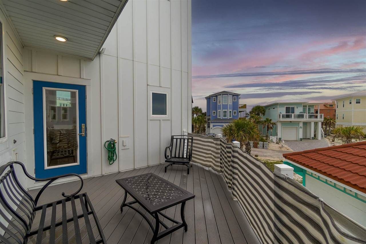 Slone modern coastal piling home on Navarre Beach by Acorn Fine Homes