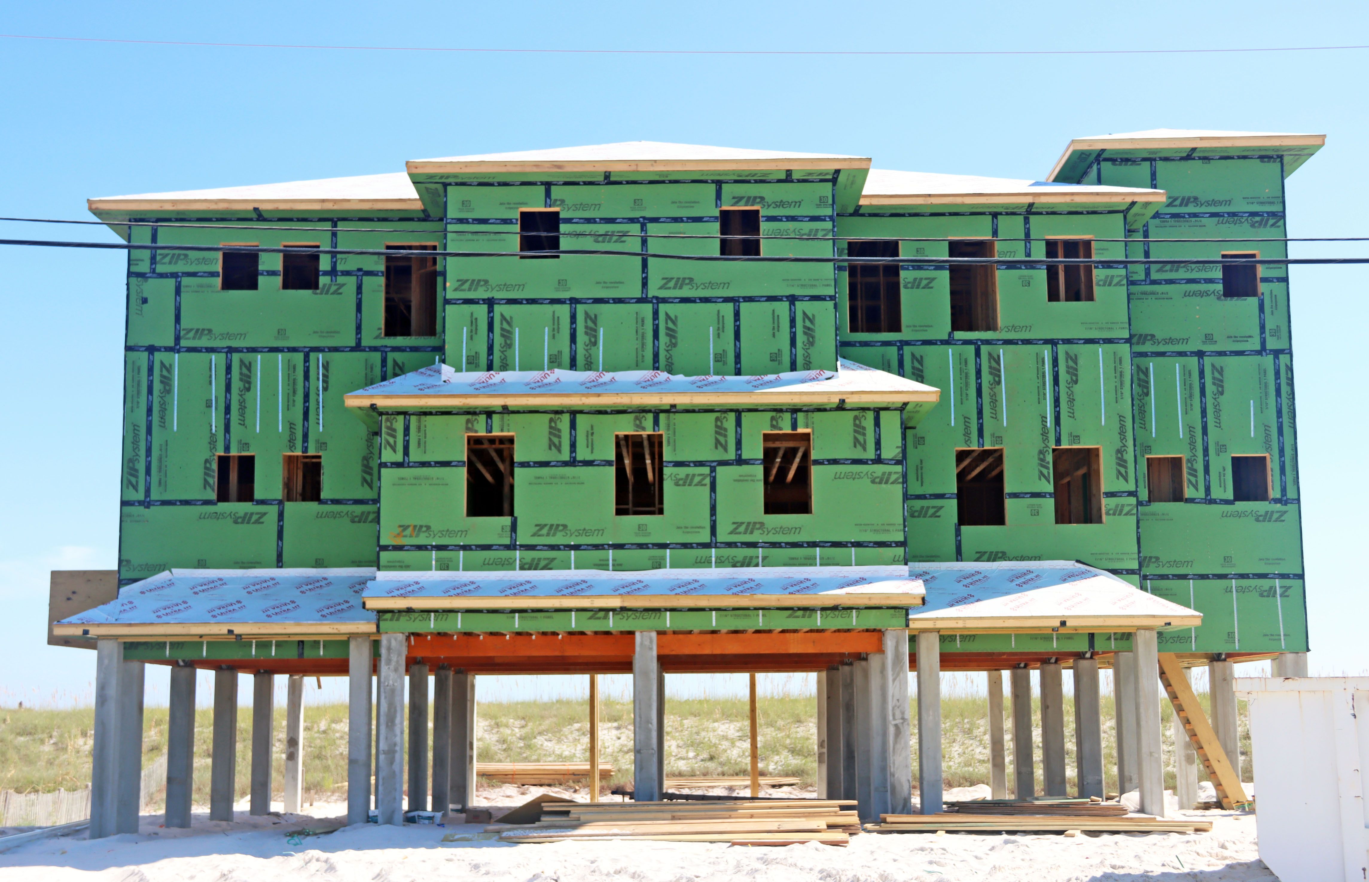 Ramsey modern coastal piling hojme in Navarre Beach by Acorn Fine Homes