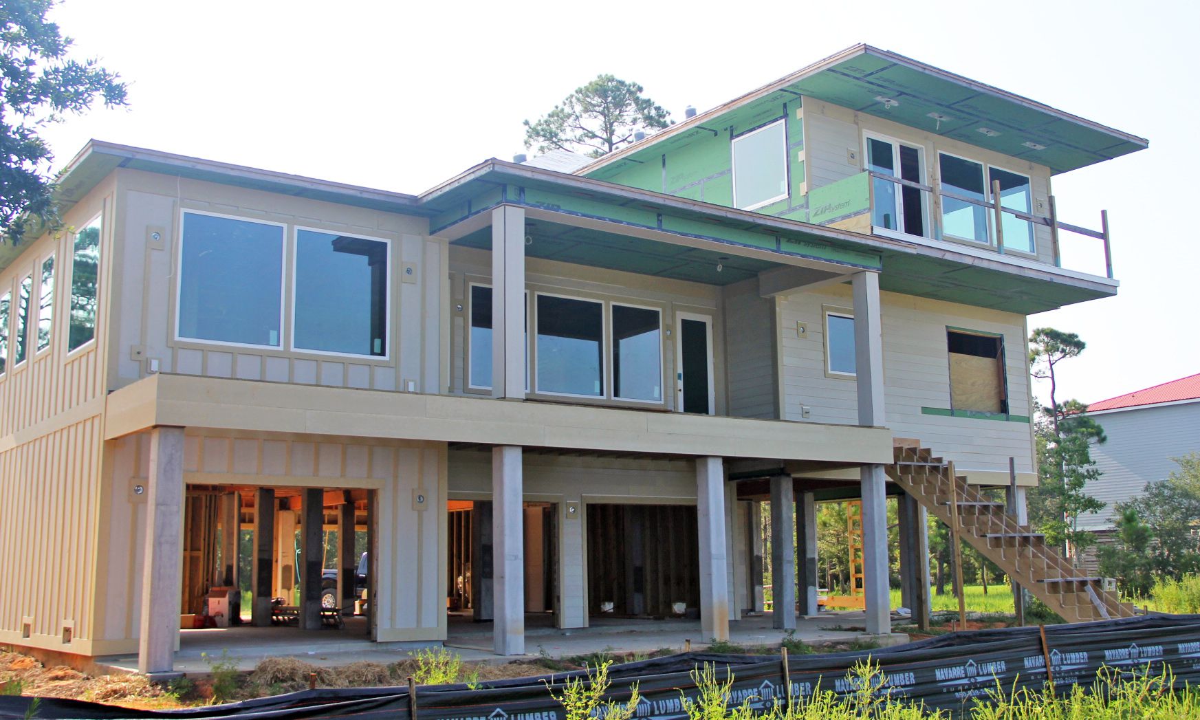 Modern piling home in Navarre by Acorn Fine Homes