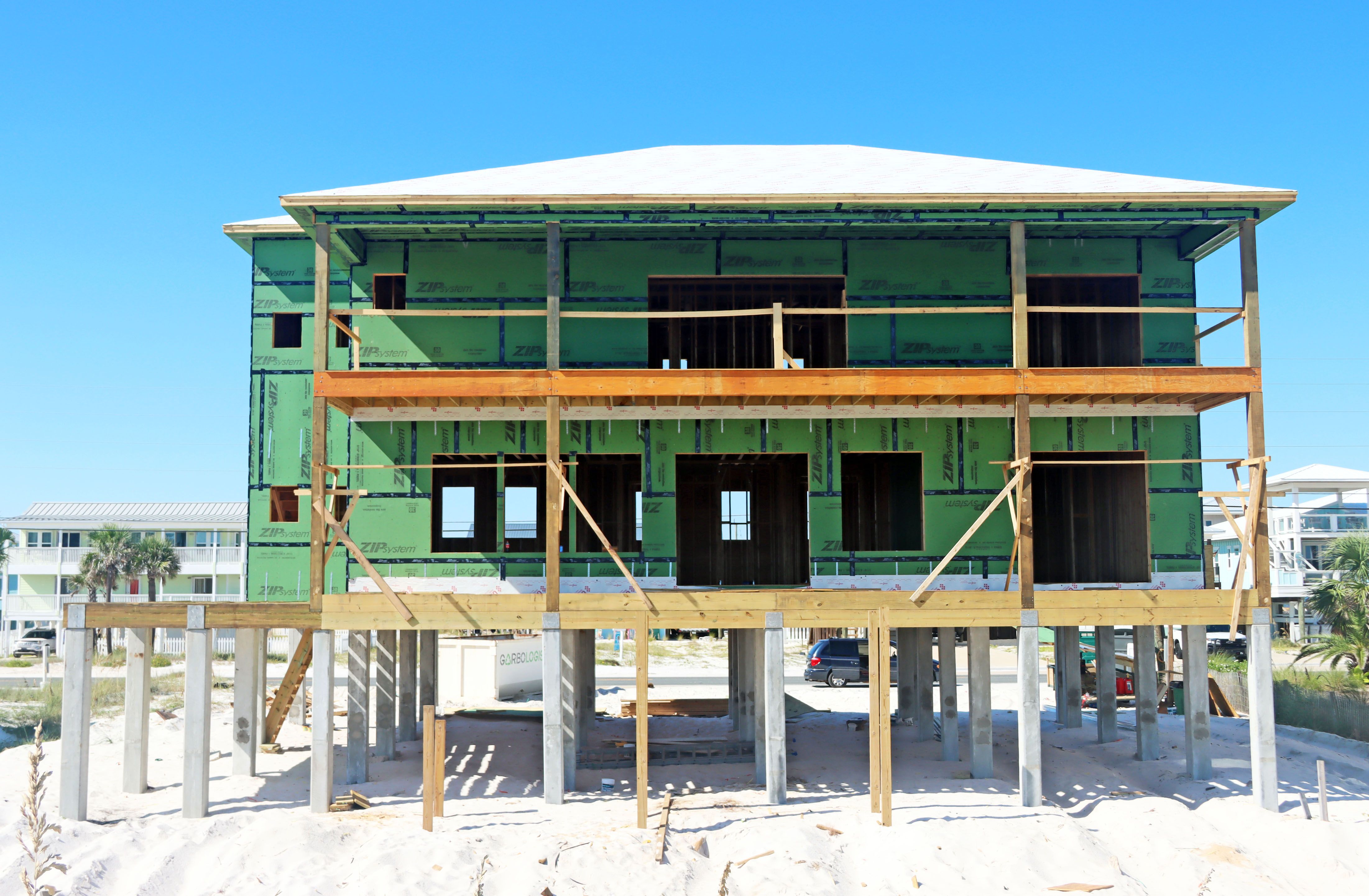 Ramsey modern coastal piling hojme in Navarre Beach by Acorn Fine Homes