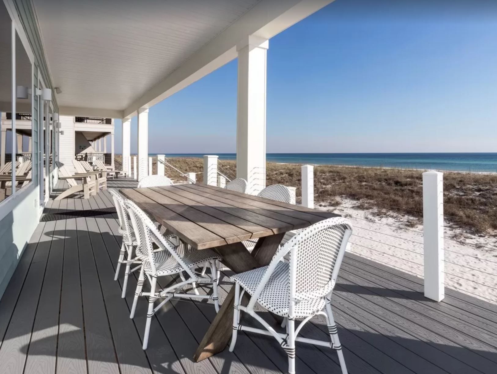 Antinnes modern coastal piling home on Navarre Beach by Acorn Fine Homes