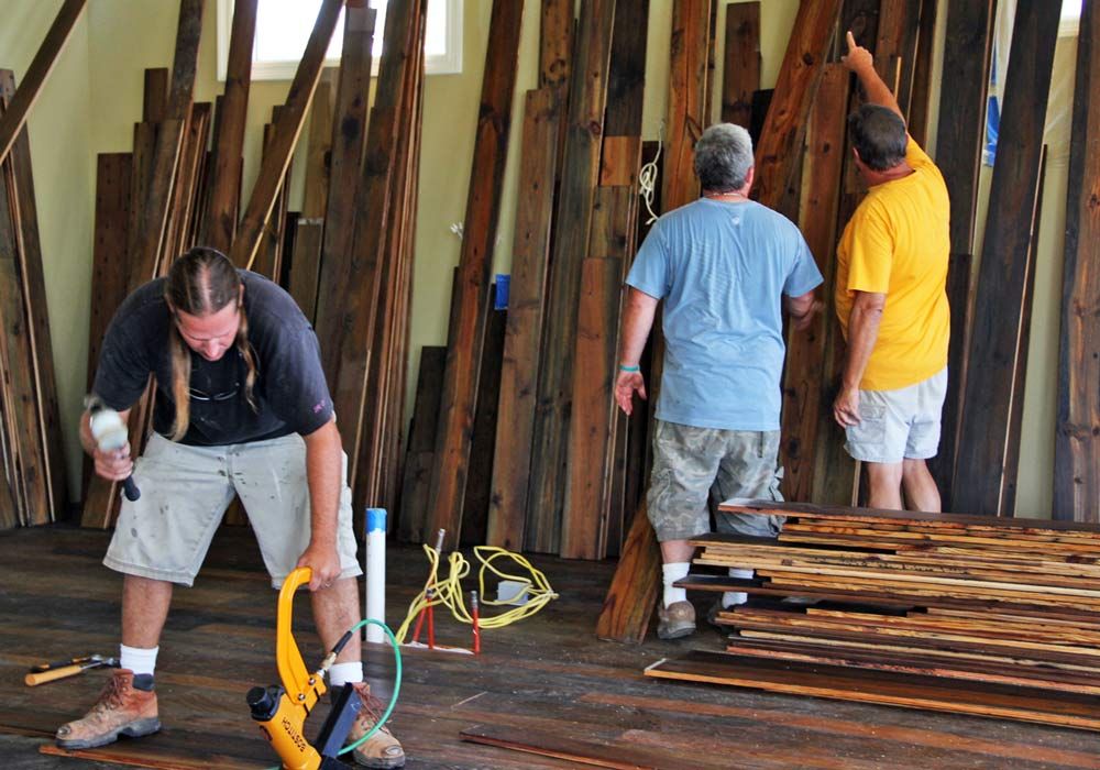 reclaimed heart pine floors in Navarre florida by Acorn Fine Homes