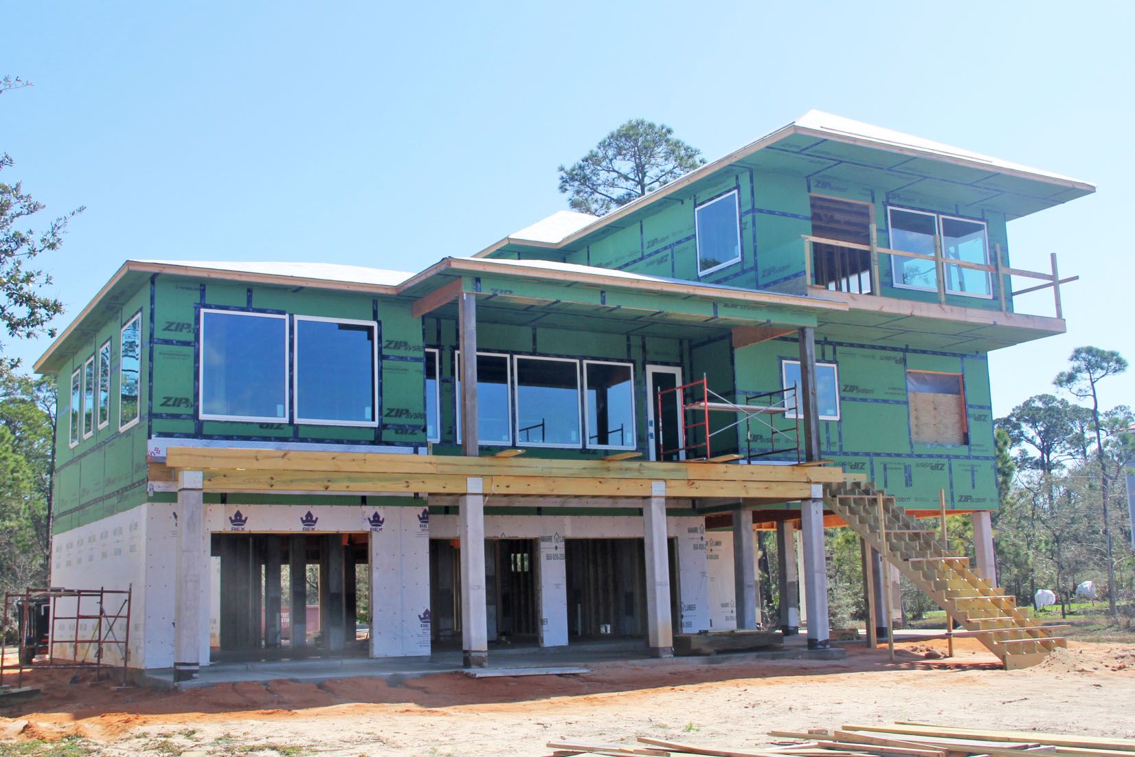 Modern piling home in Navarre by Acorn Fine Homes