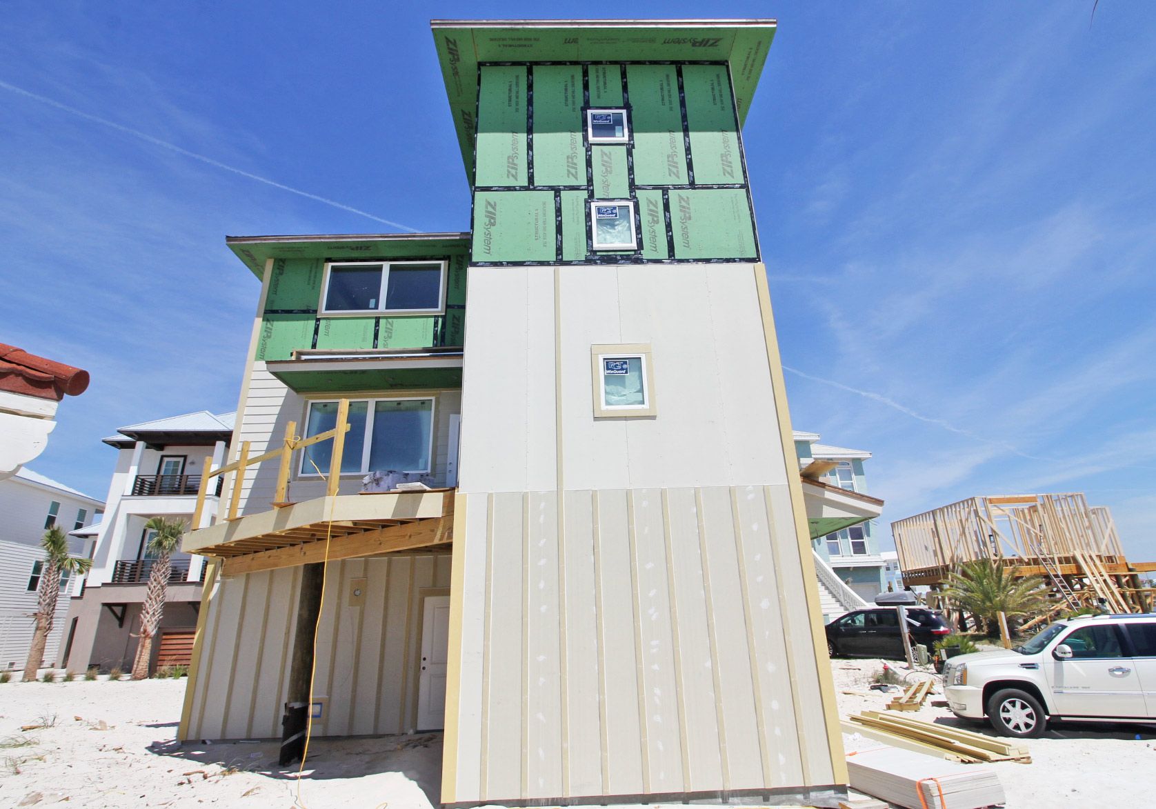 Slone modern coastal piling home on Navarre Beach by Acorn Fine Homes