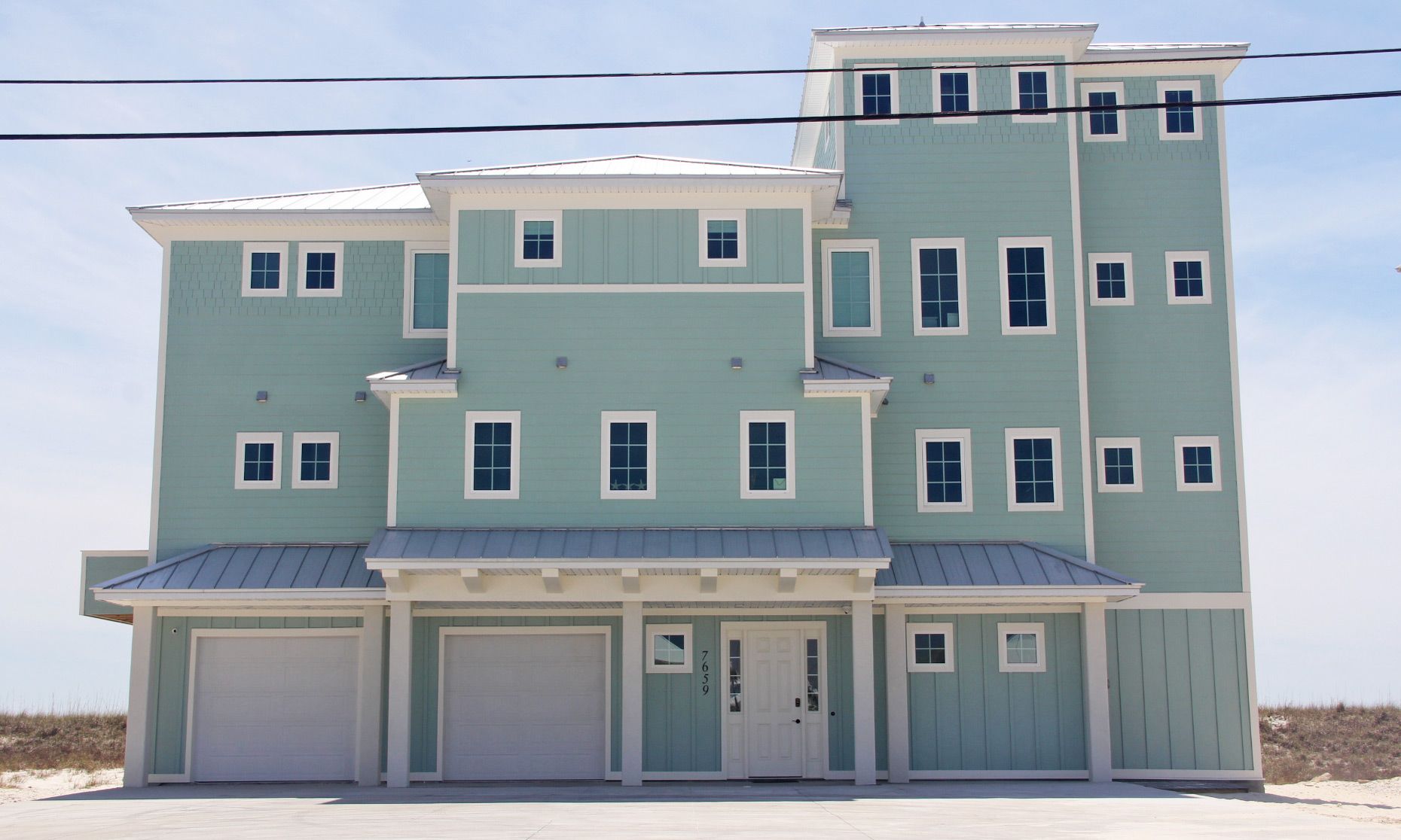 Antinnes concrete piling home on Navarre Beach by Acorn Fine Homes