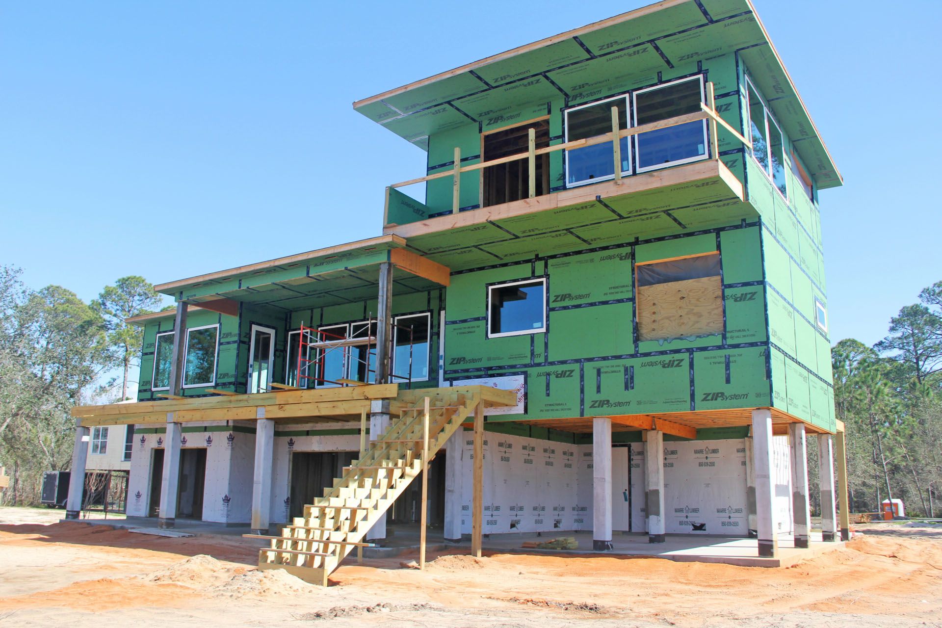 Modern piling home in Navarre by Acorn Fine Homes