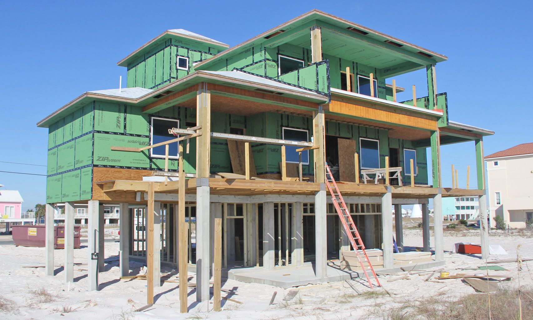 Burchard modern coastal style piling home on Navarre by Acorn Fine Homes