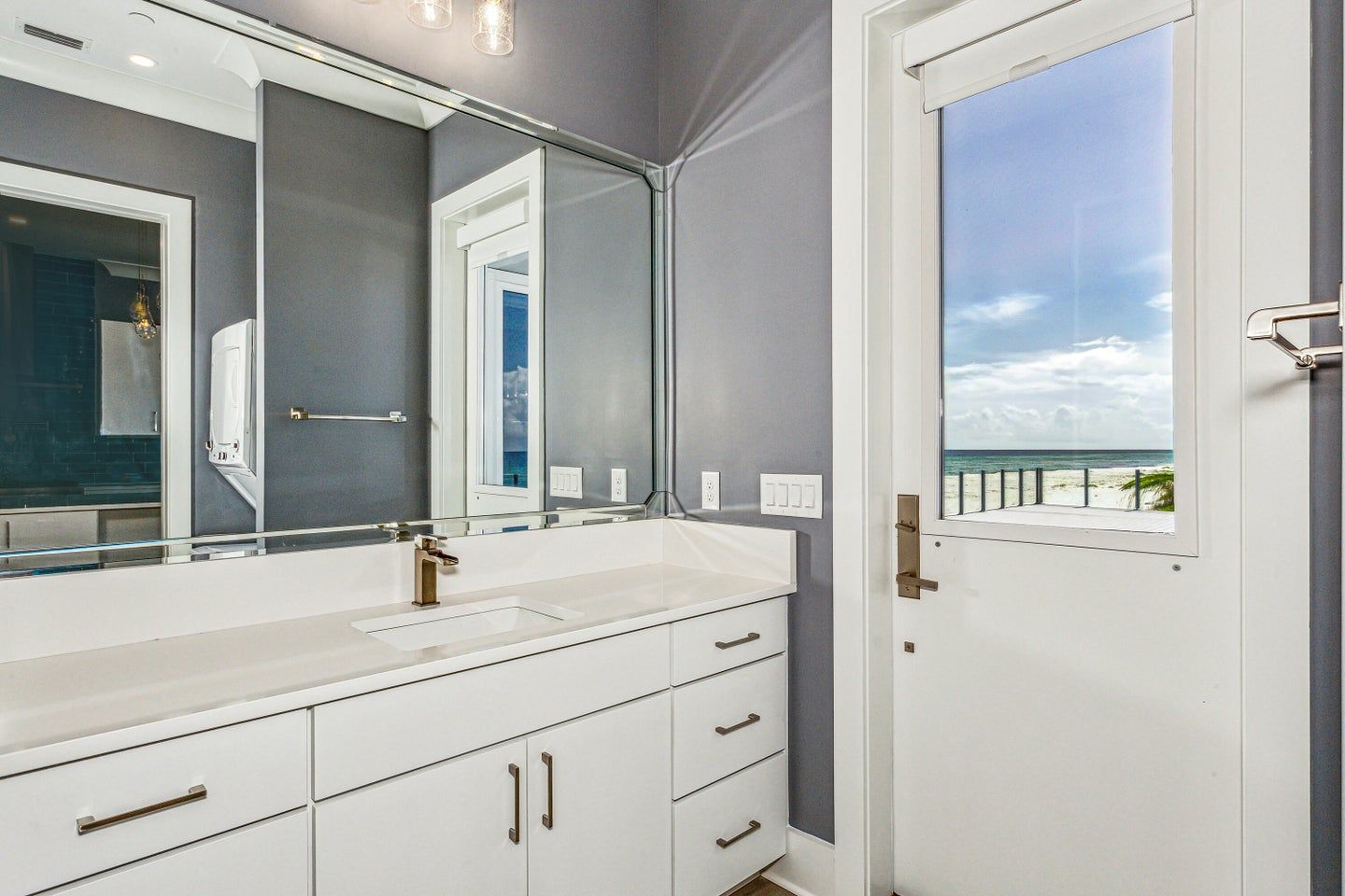 Modern coastal piling home in Navarre by Acorn Fine Homes